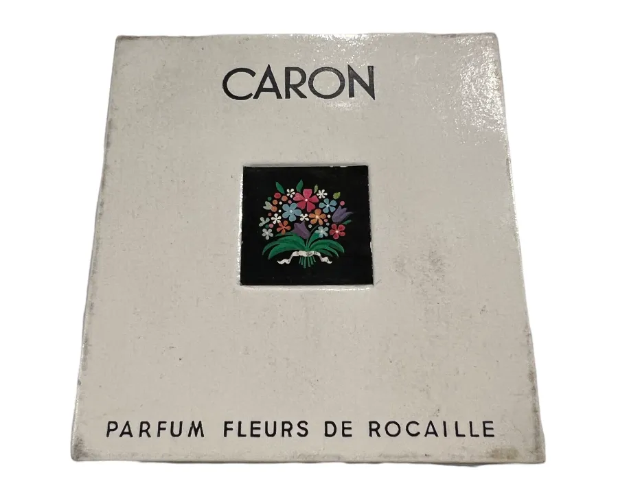 Flacon de parfum antique avec un design floral coloré