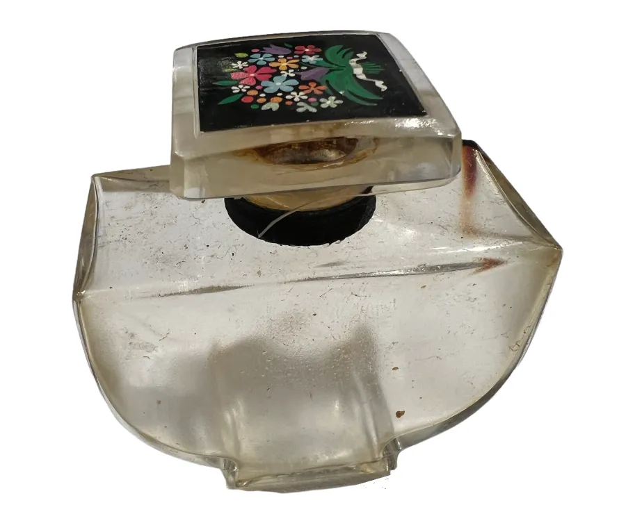 زجاجة-عطر-قديمة-مع-غطاء-مزخرف-زهور