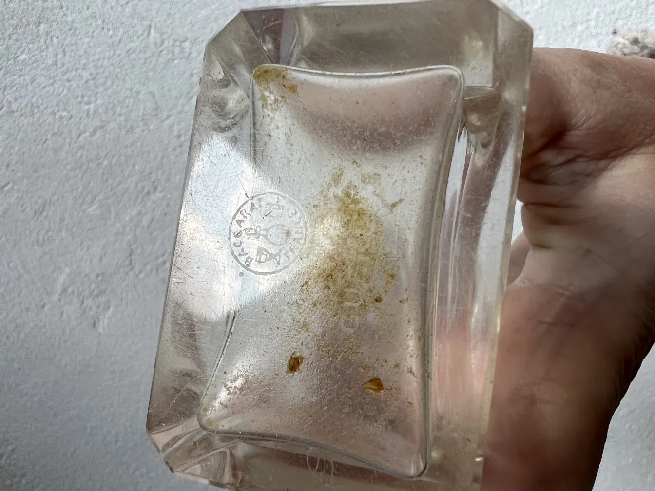 antique perfume bottle with rectangular shape and base markings