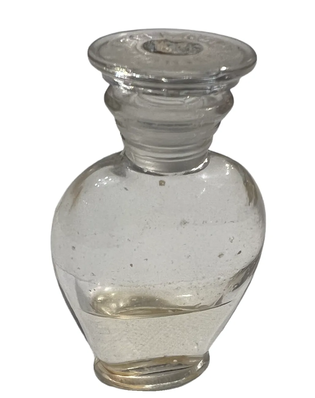 frasco de perfume antiguo de cristal transparente con tapa