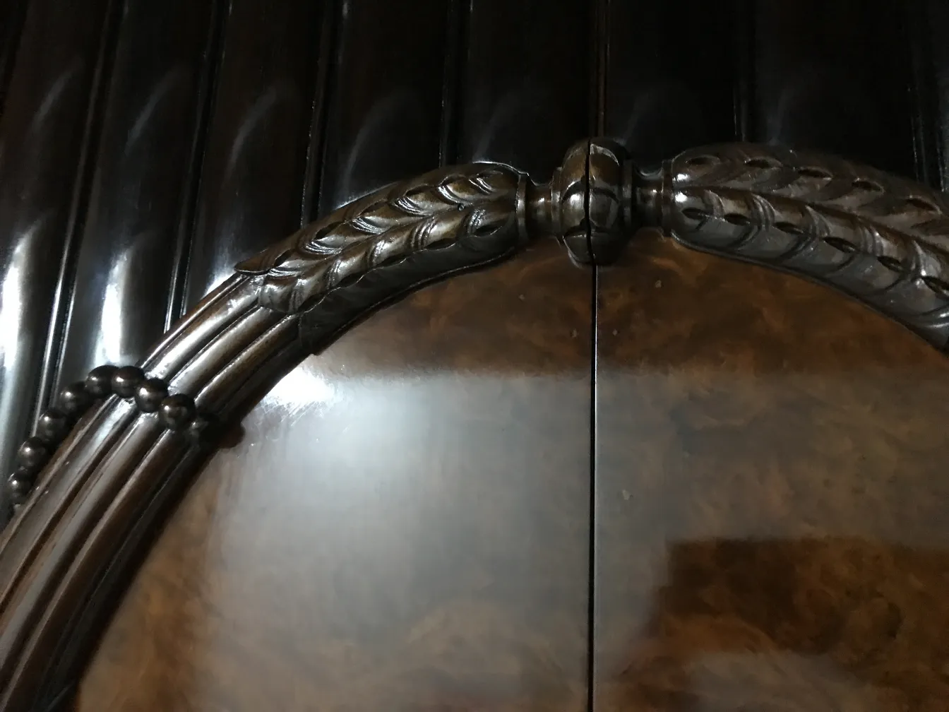 Antique display cabinet with decorative door details