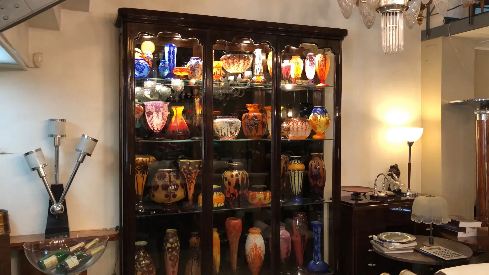 antique display cabinet showcasing beautiful colorful vases