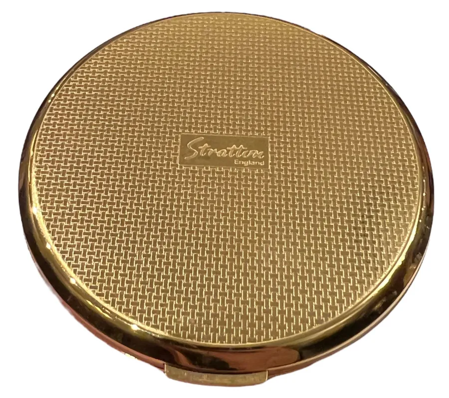 antiker goldener kompakt mit eleganter textur