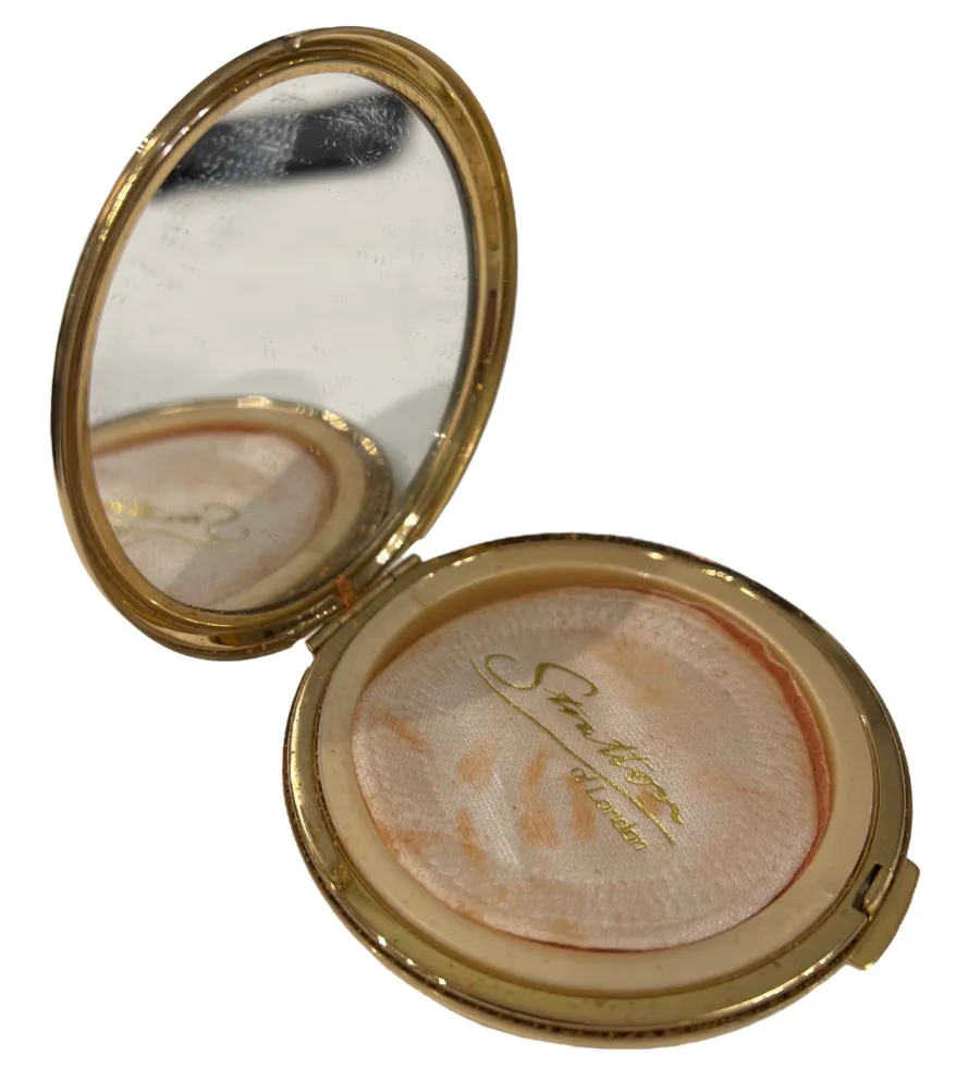 polvera antica con design elegante e specchio interno