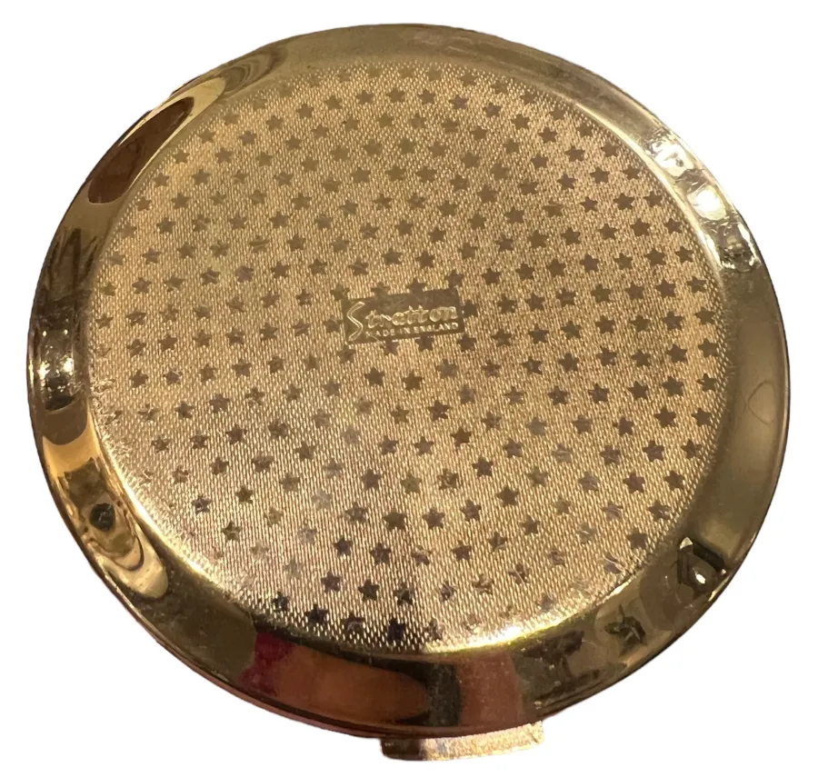 古いコンパクト stratton england ゴールデンな表面と星のデザイン