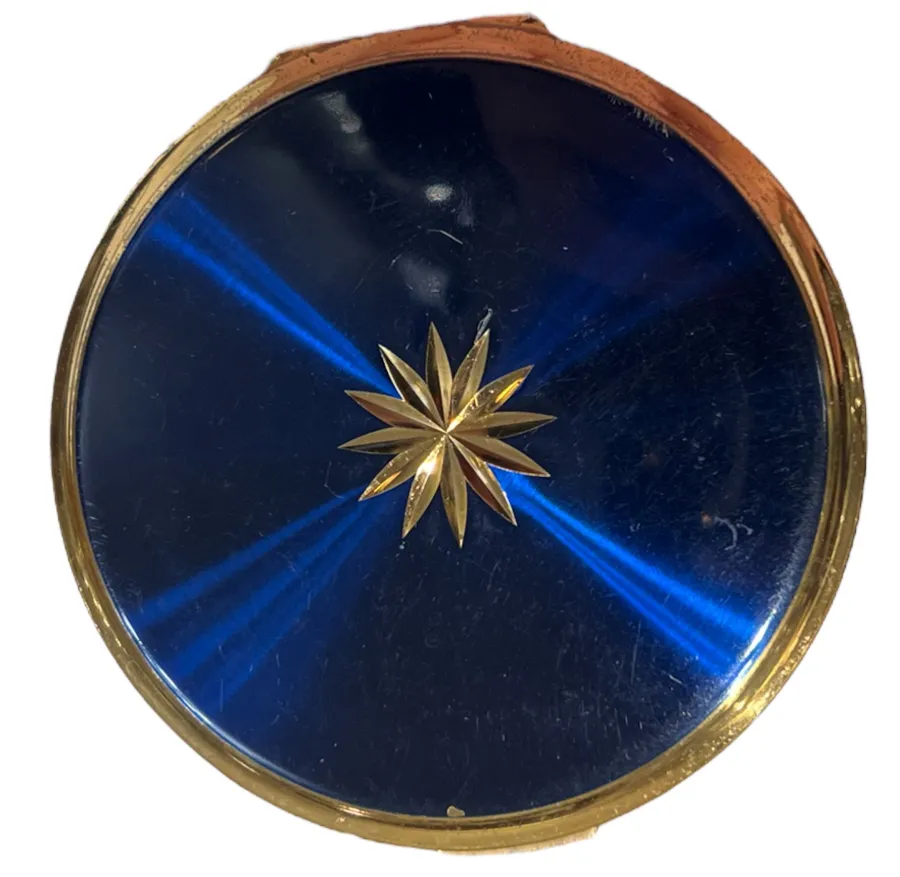 runde antike kompakt in blau mit goldener stern