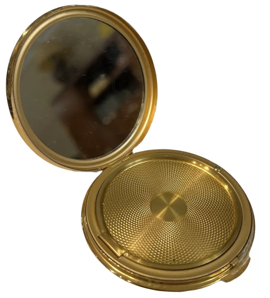 vintage golden compact with mirror and textured design