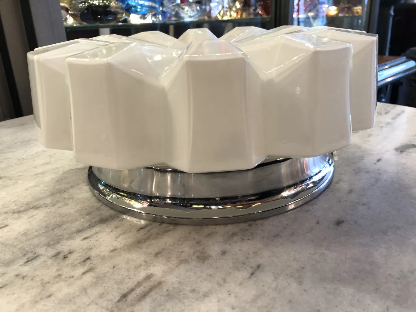 antique ceiling light with geometric design in white