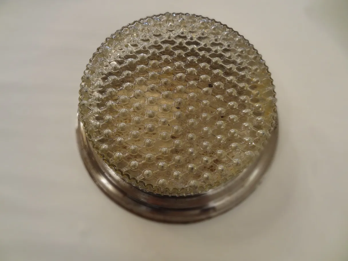 antique ceiling light with rounded shape and textured cover