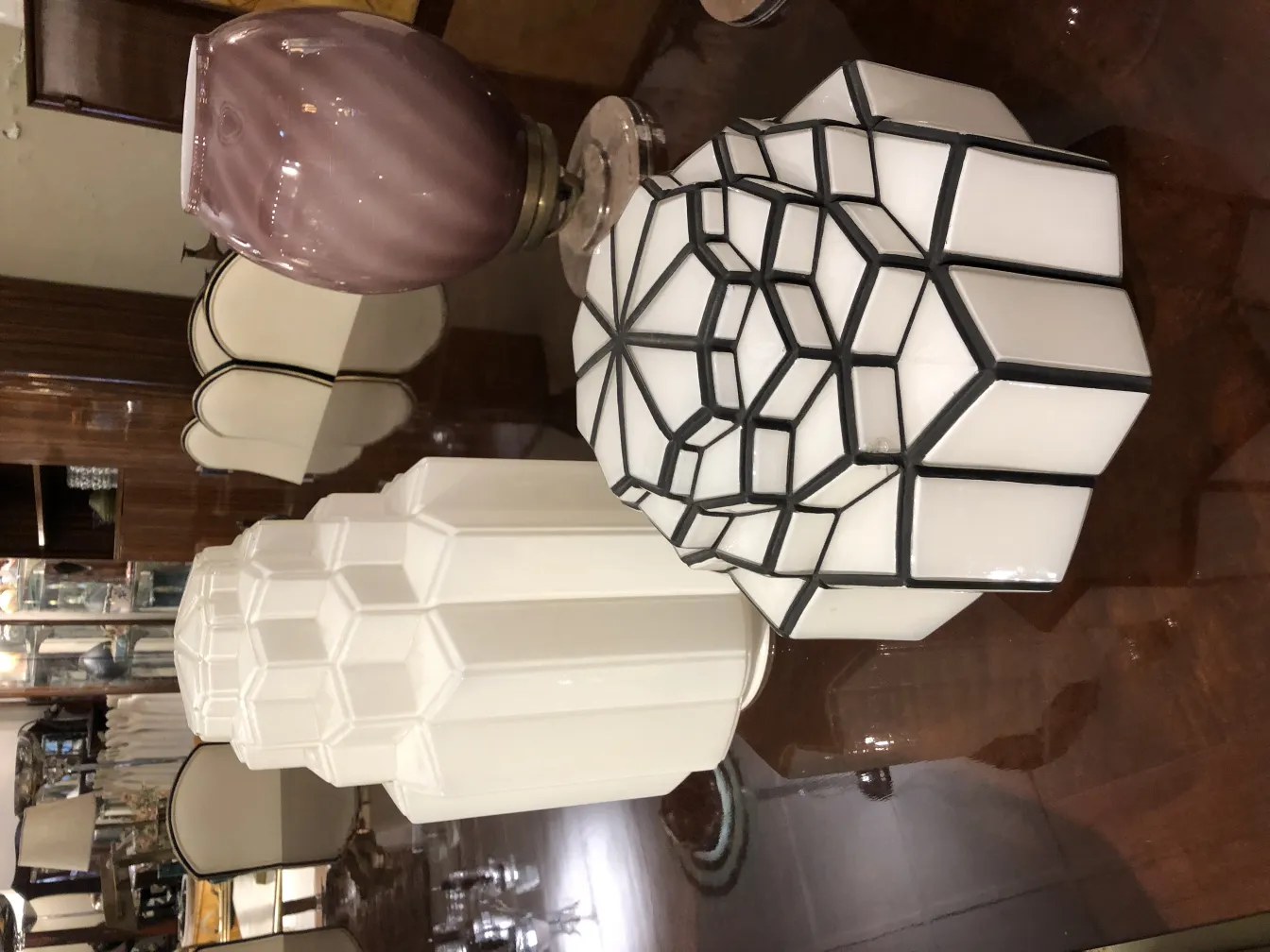 Two ceiling lights with geometric shapes in an elegant setting