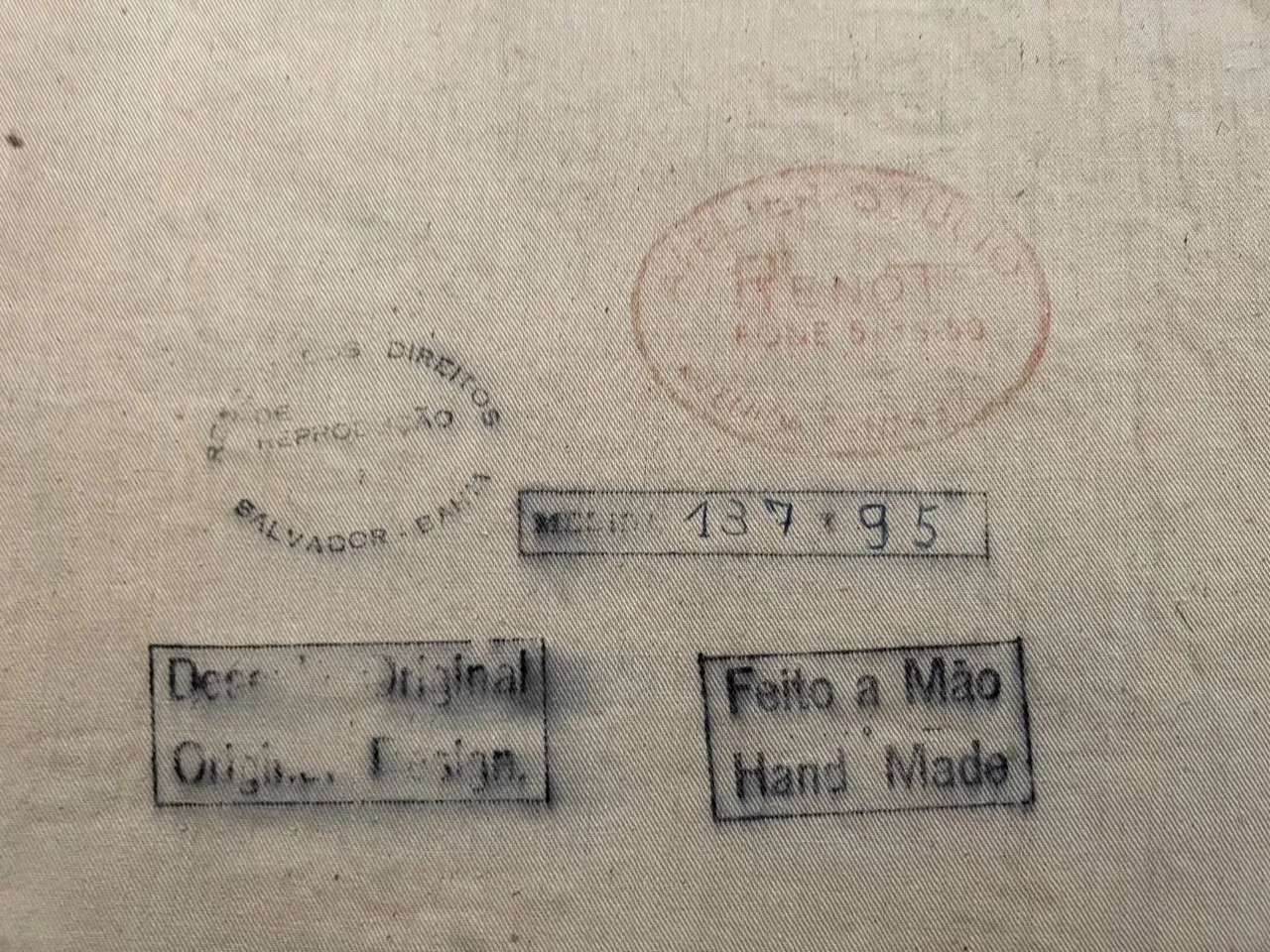 antique tapestry with decorative prints and stamps