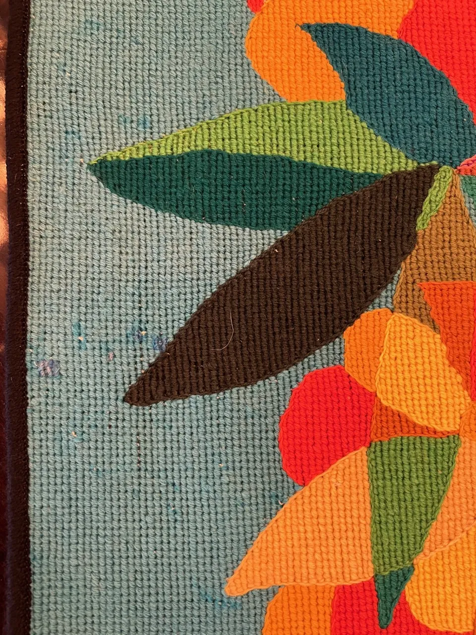 antique tapestry with vibrant flower design