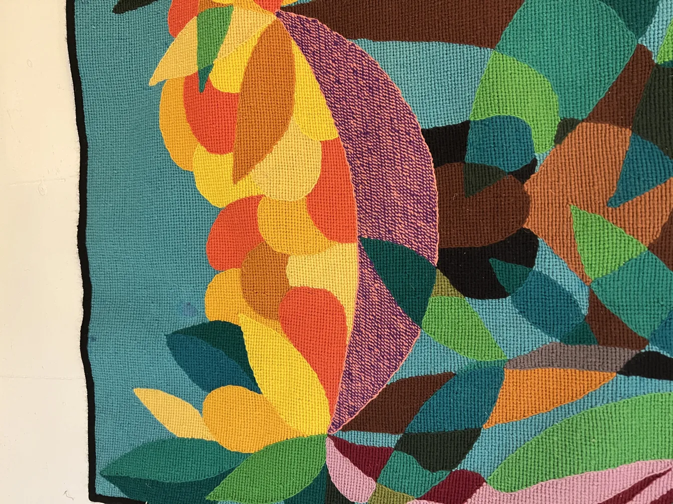 antique tapestry featuring a rich combination of colorful leaves and flowers