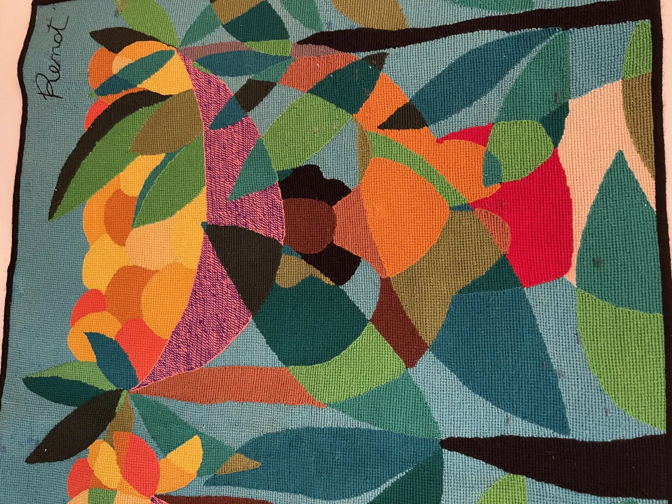 antique tapestry featuring a colorful design of leaves and fruits in vibrant tones