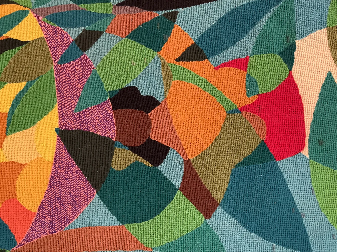 ancient tapestry with colorful leaf and fruit patterns