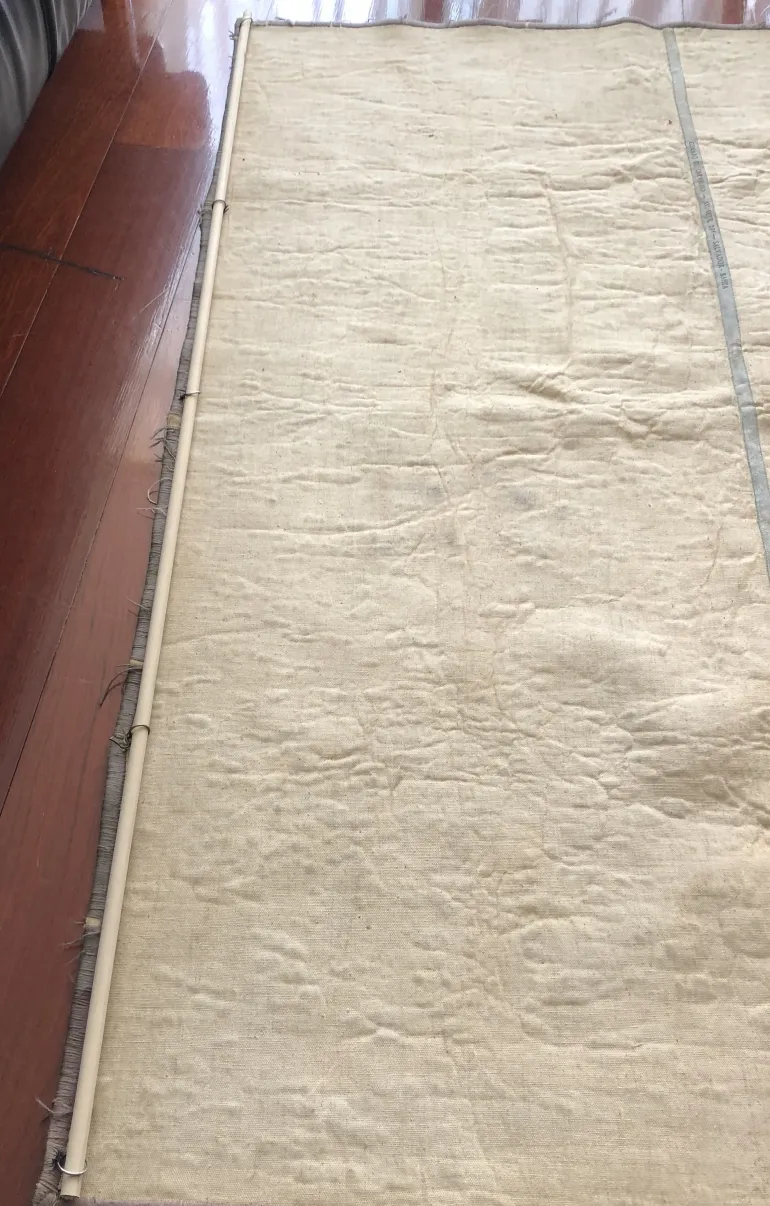 antique decorative tapestry in light color with visible texture