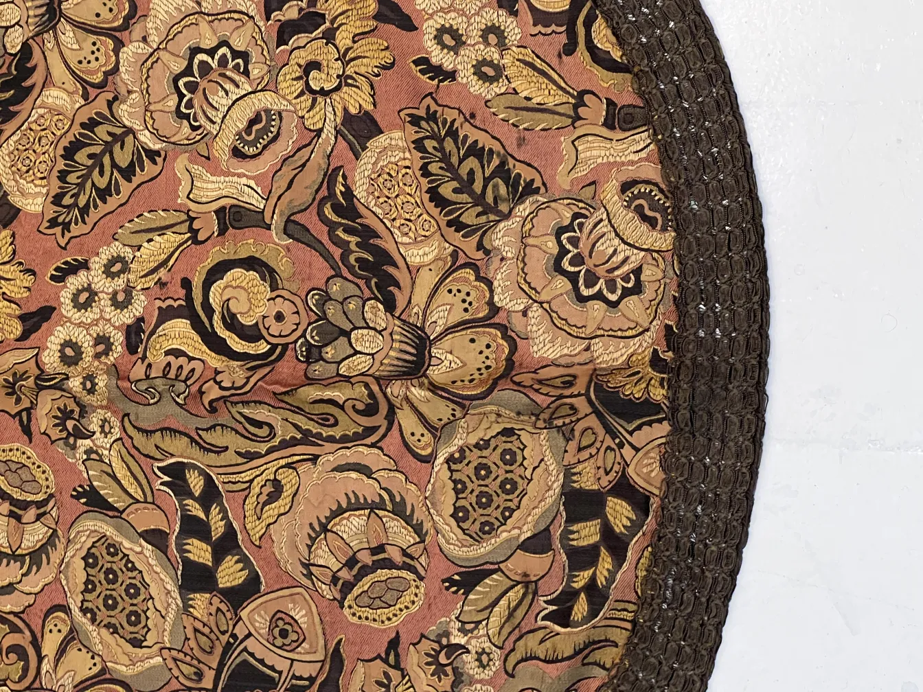 Antique decorative tablecloth with a colorful floral design