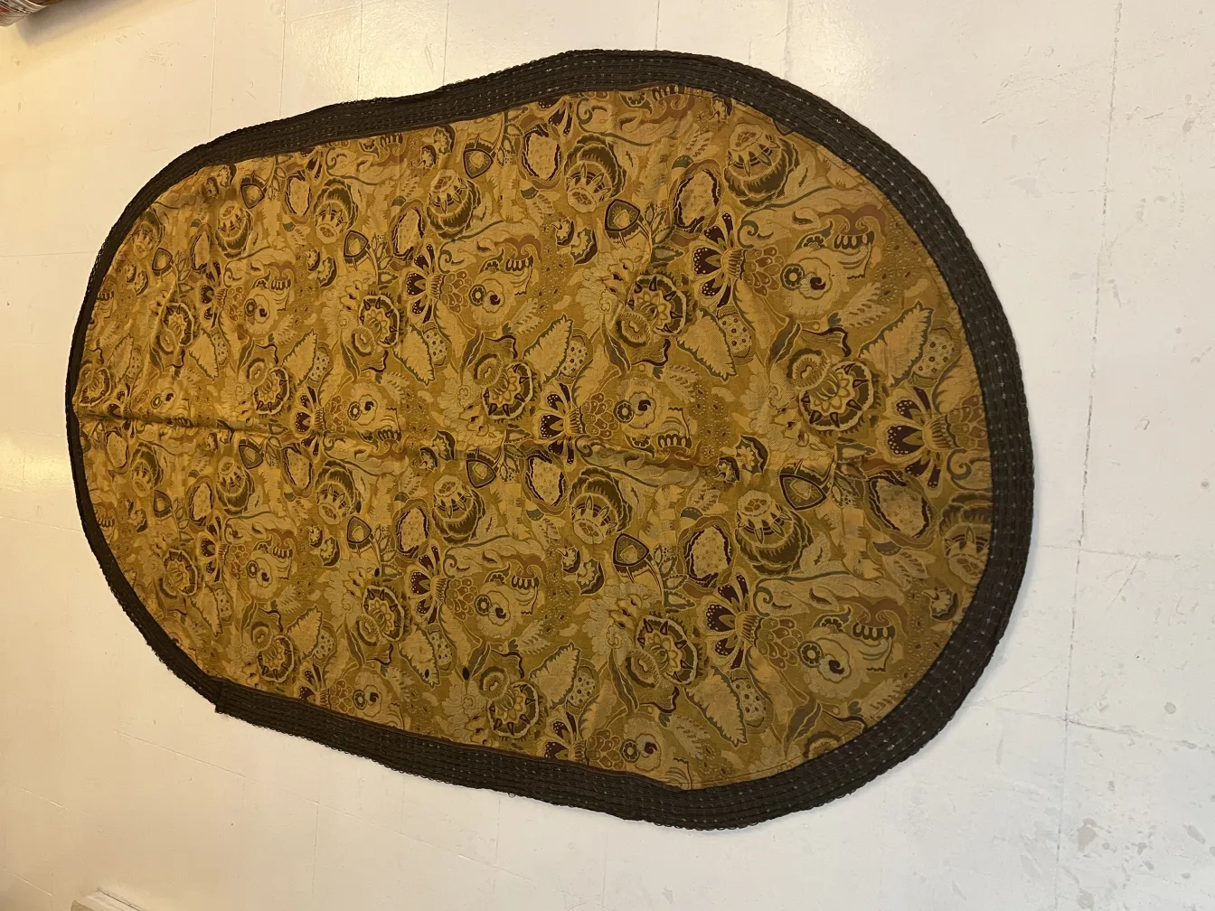 antique floral tablecloth with oval design in golden tones