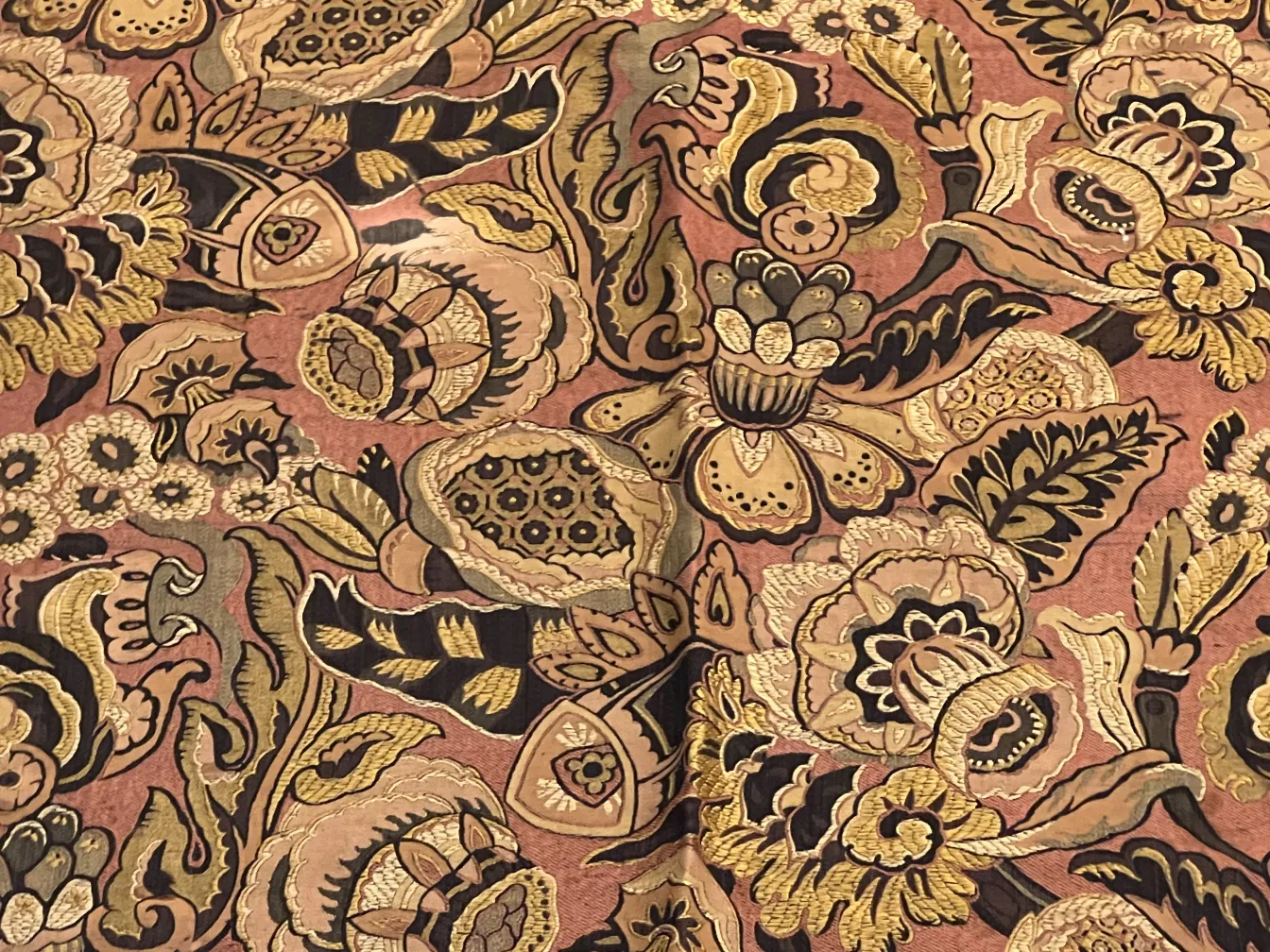 antique tablecloth with warm colors and floral patterns