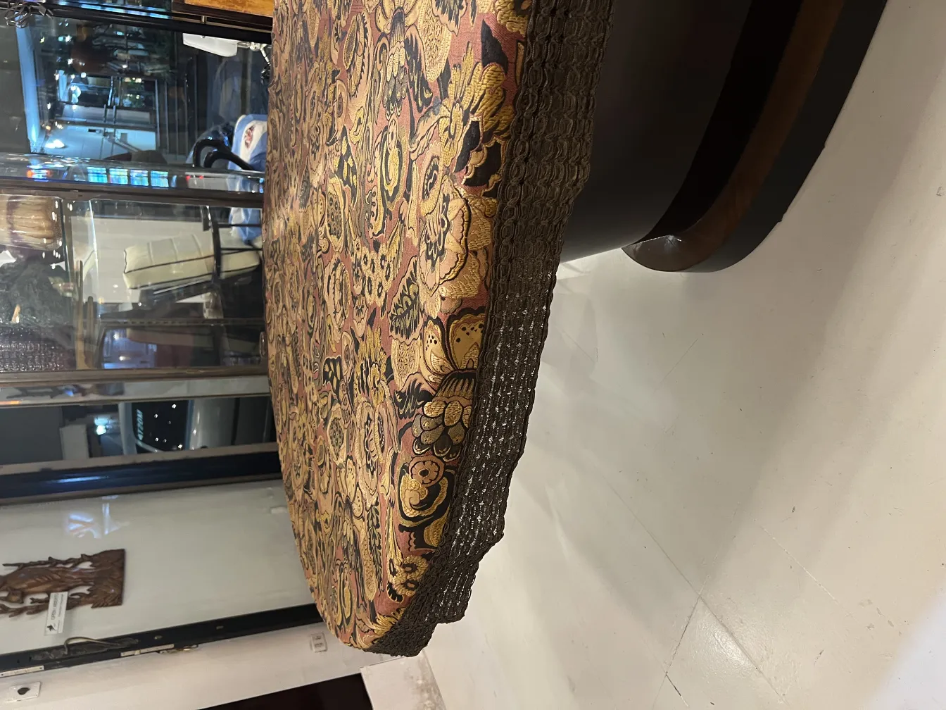 antique tablecloth with warm-toned floral patterns, enhancing a table setting