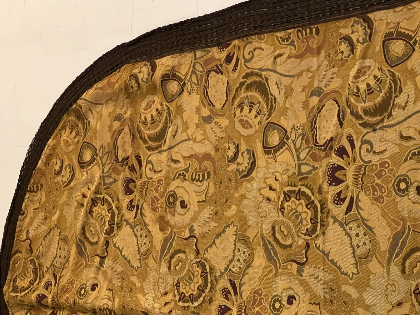 antique tablecloth with floral pattern in golden tones