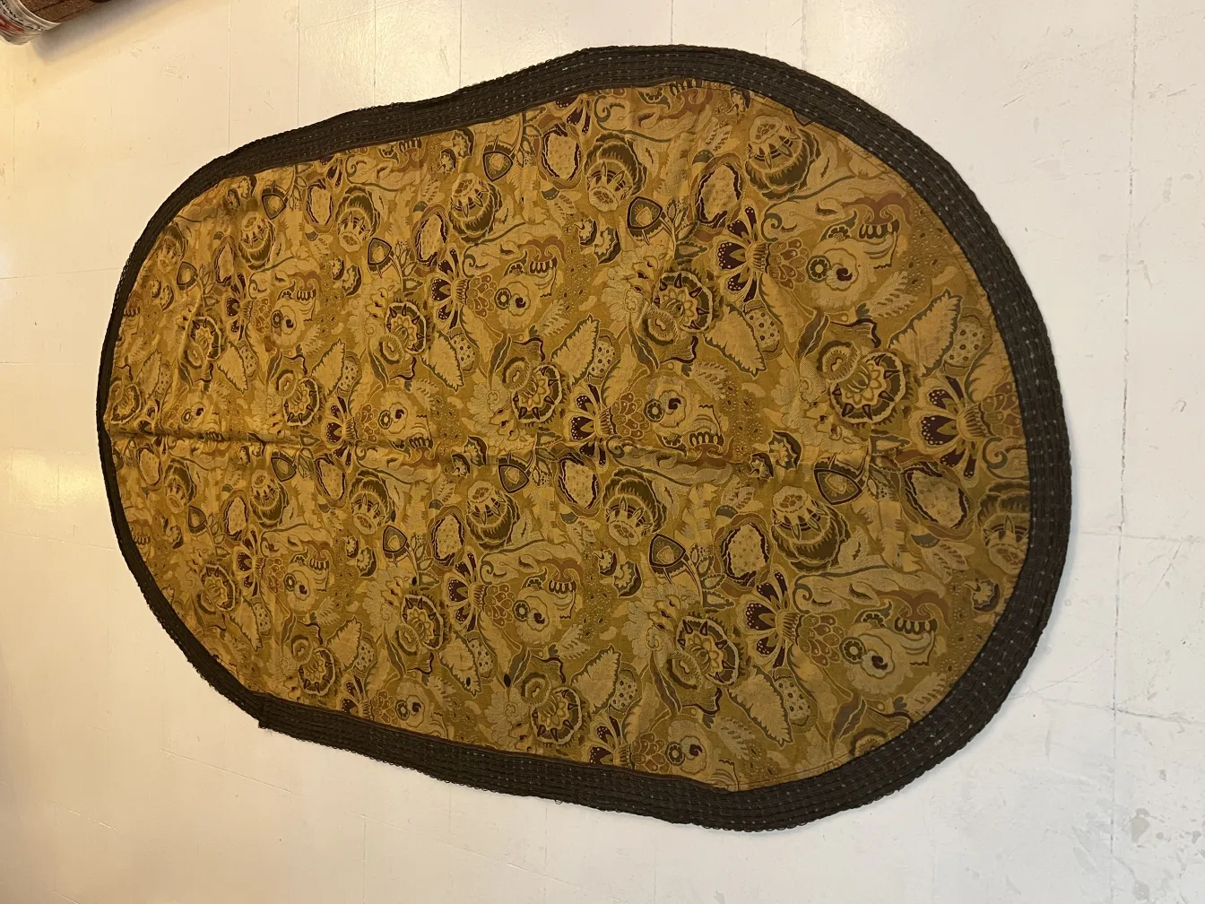 antique tablecloth with floral pattern on yellow background