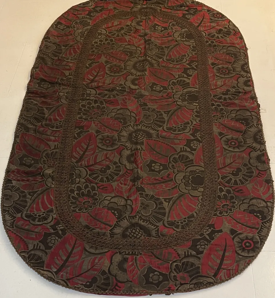 antique tablecloth featuring floral patterns in dark tones