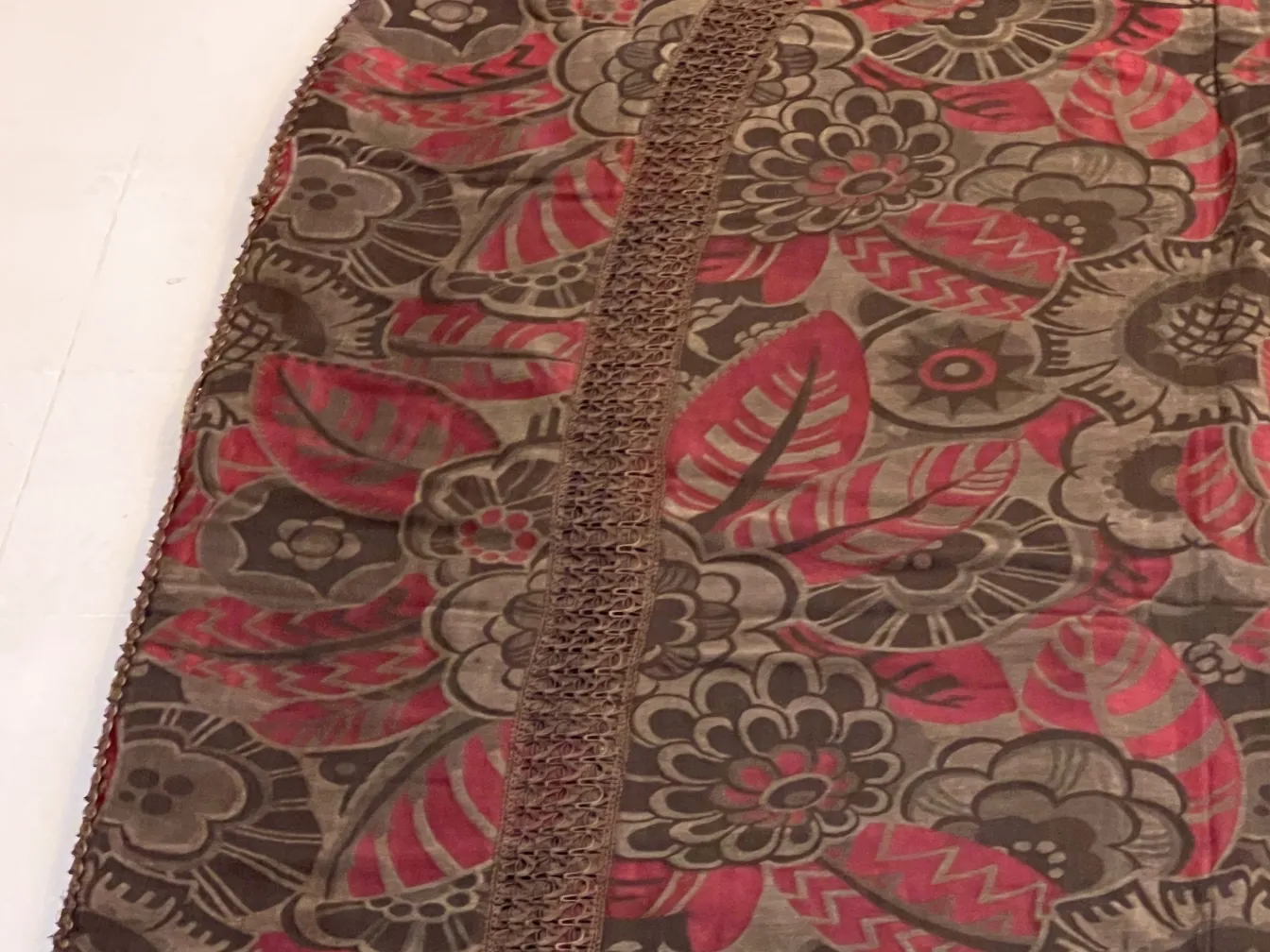 antique tablecloth with colorful floral design in red and brown