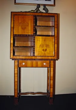 Antique cigar humidor featuring Koloman Moser design with visible shelves.