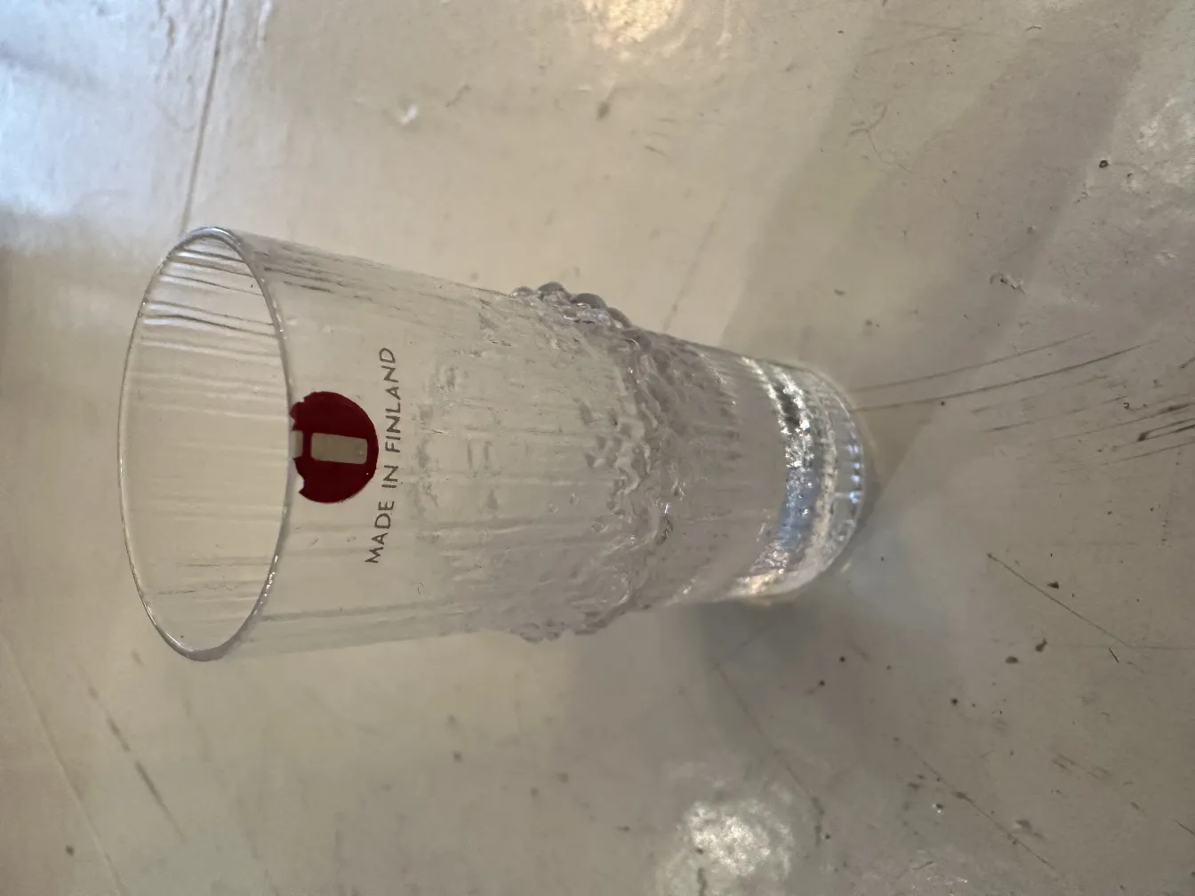 six antique glasses of tapio wirkkala in a decorative setting