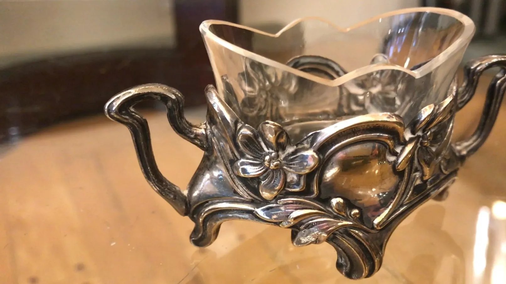 antique salt and pepper shakers WMF with floral metal details and scalloped edge.