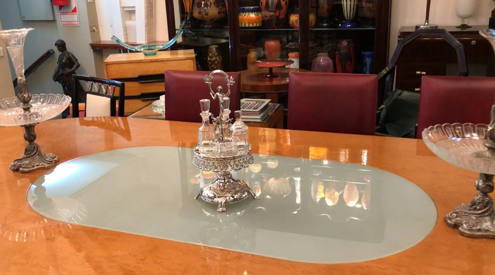 Antique set of salt shaker, pepper shaker, oil and vinegar WMF on a glass table.