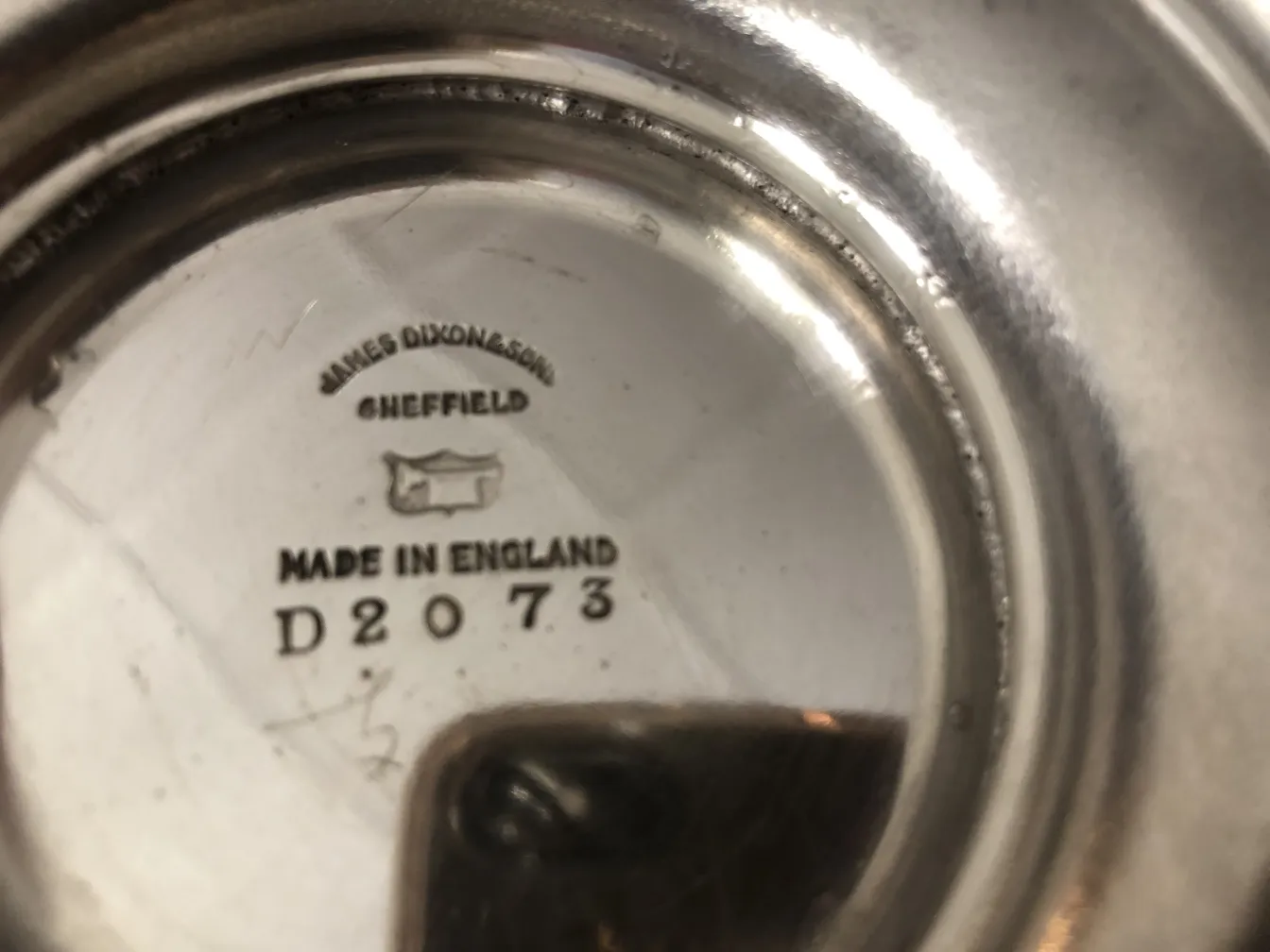 Antique pastry plate with decorative details on the base.