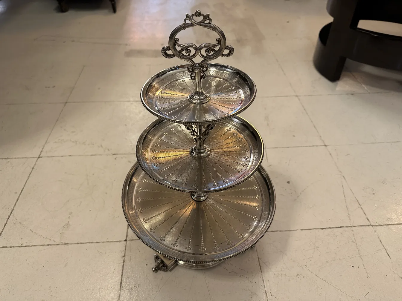 Antique pastry plate with three-tier stand design.