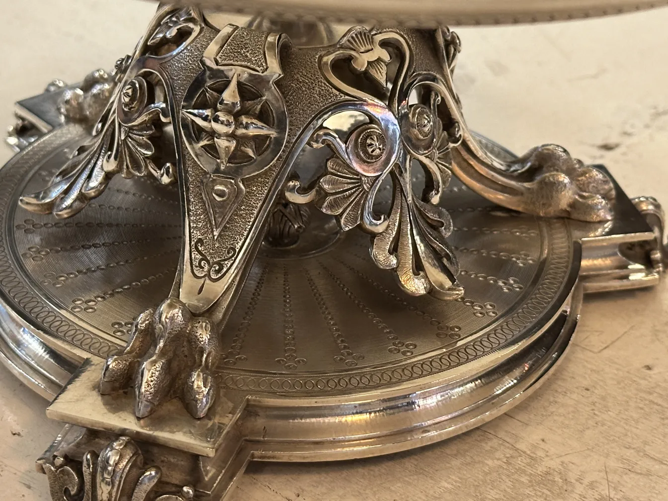 Antique pastry plate featuring a detailed decorative base, crafted with artistic design.