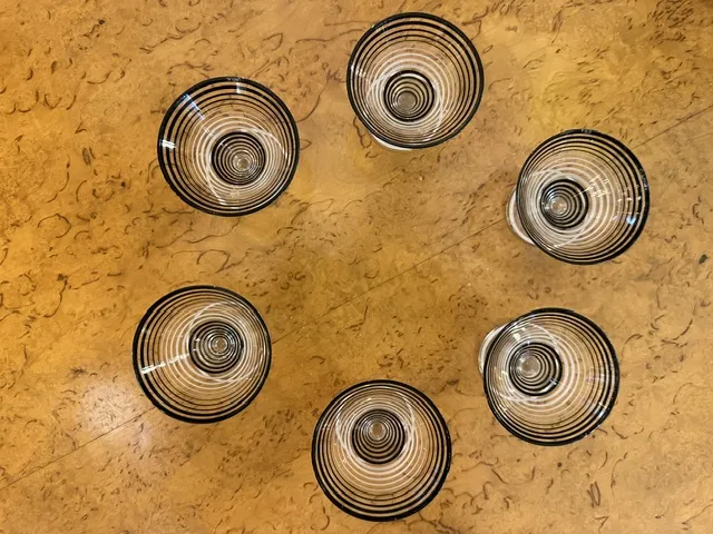 set of 6 glasses with spiral design on a surface