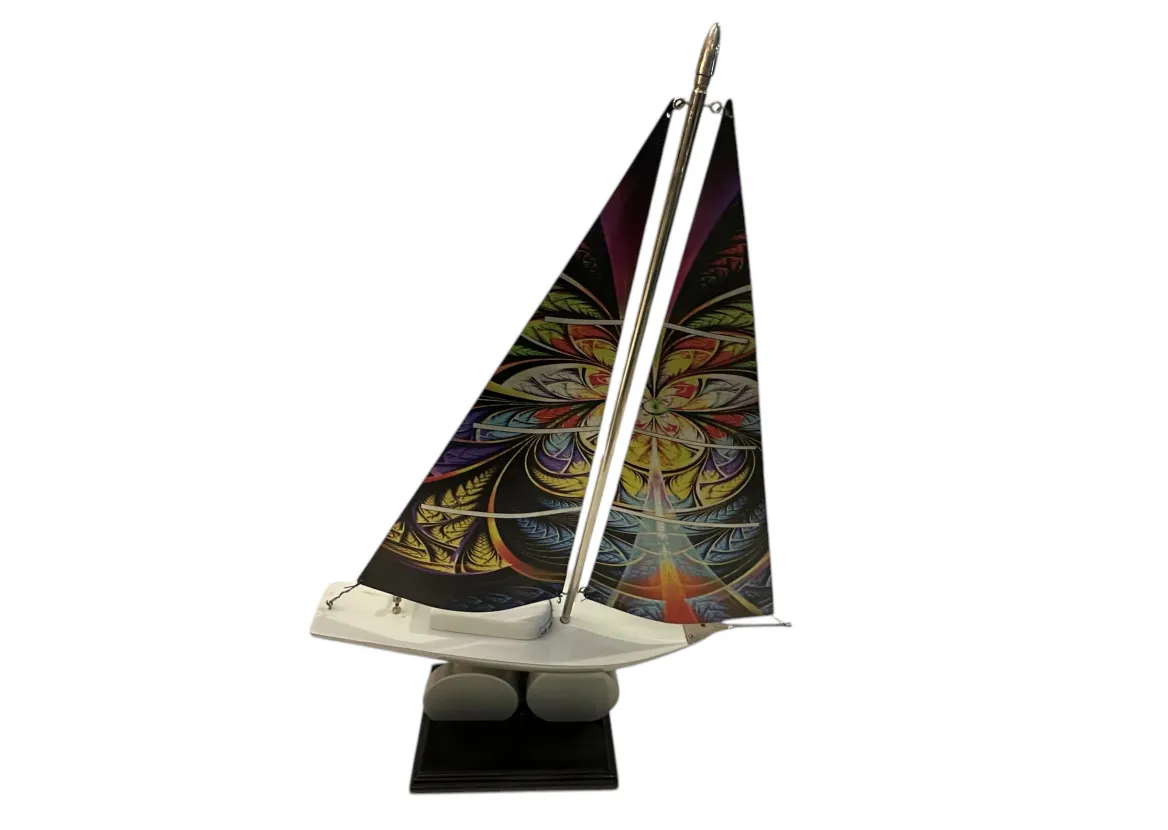 Antique designer's ship with colorful patterned sails