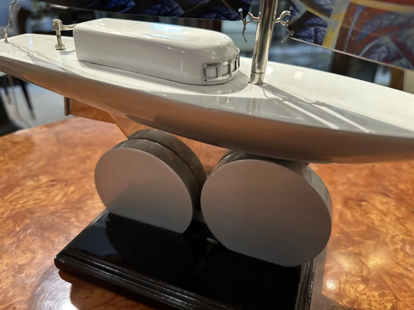 antique ship model designed by marcelo pena, displayed in an elegant setting