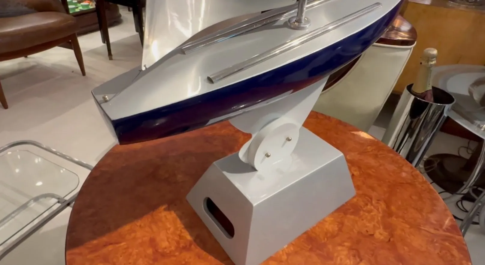 designer's ship on a sleek white base, elegant detail.