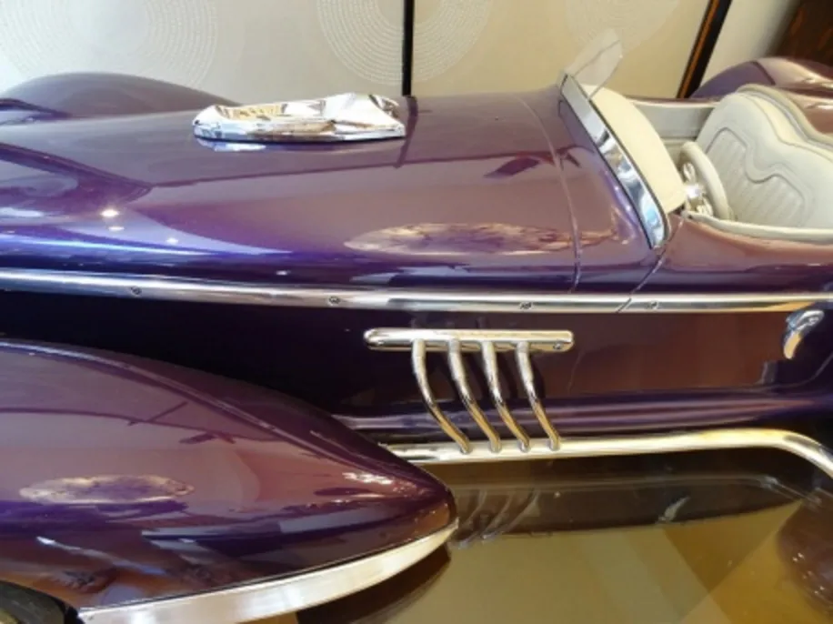Antique car by designer Marcelo Peña in purple with silver details