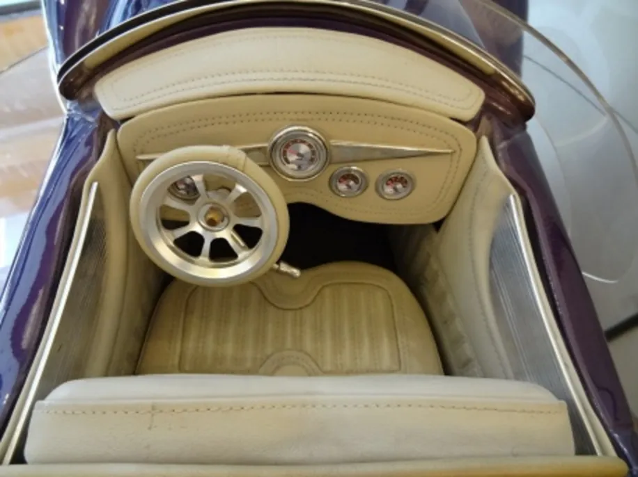 interior of an antique designer Marcelo Peña's car with wheel and gauges