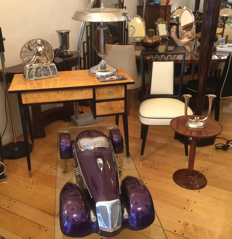 Antique car by designer Marcelo Peña in a vintage setting.