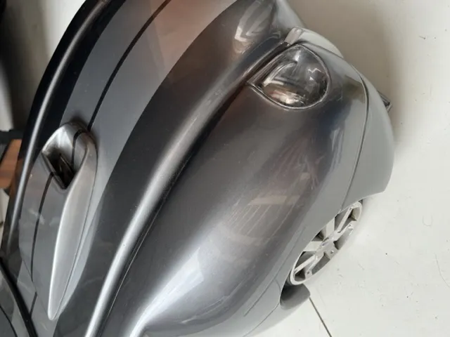 side view of an antique designer car in gray color