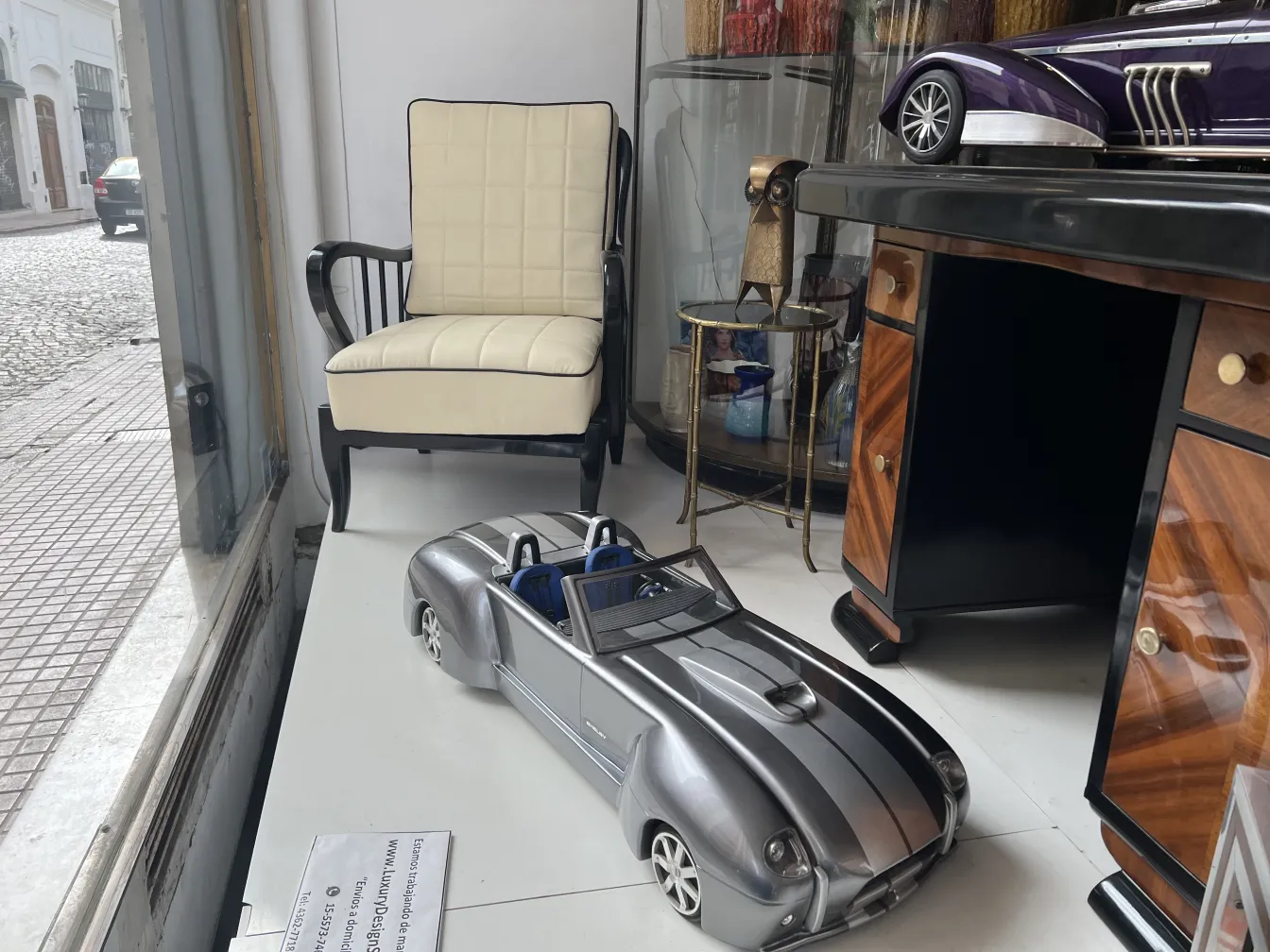 Antique model car by designer Marcelo Peña in a stylish setting