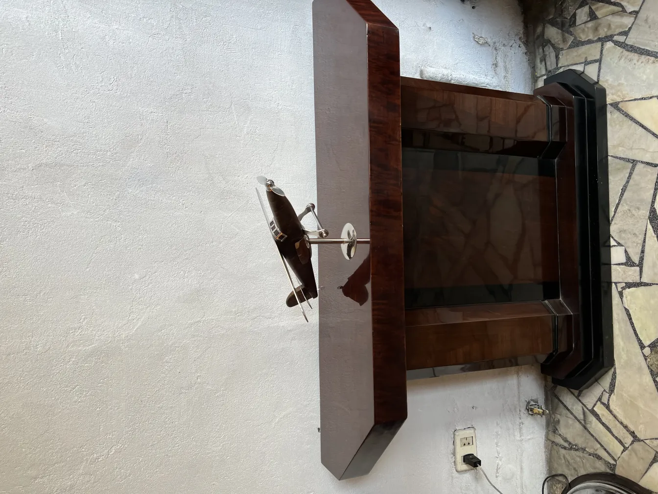Antique airplane model by designer Marcelo Peña, displayed against a light background.
