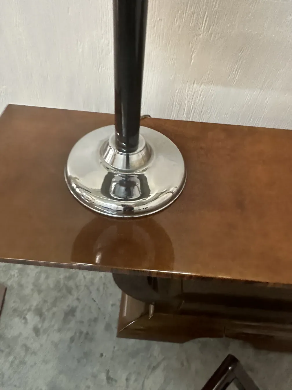 Antique console furniture with shiny details at the base.