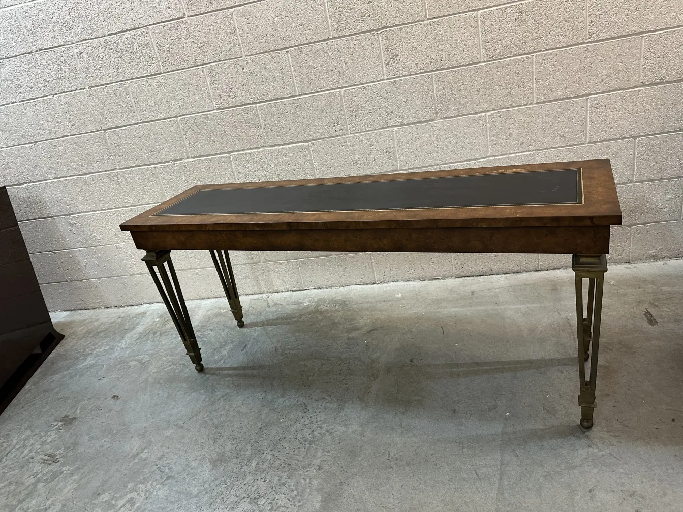 antique console with surface details and elegant legs