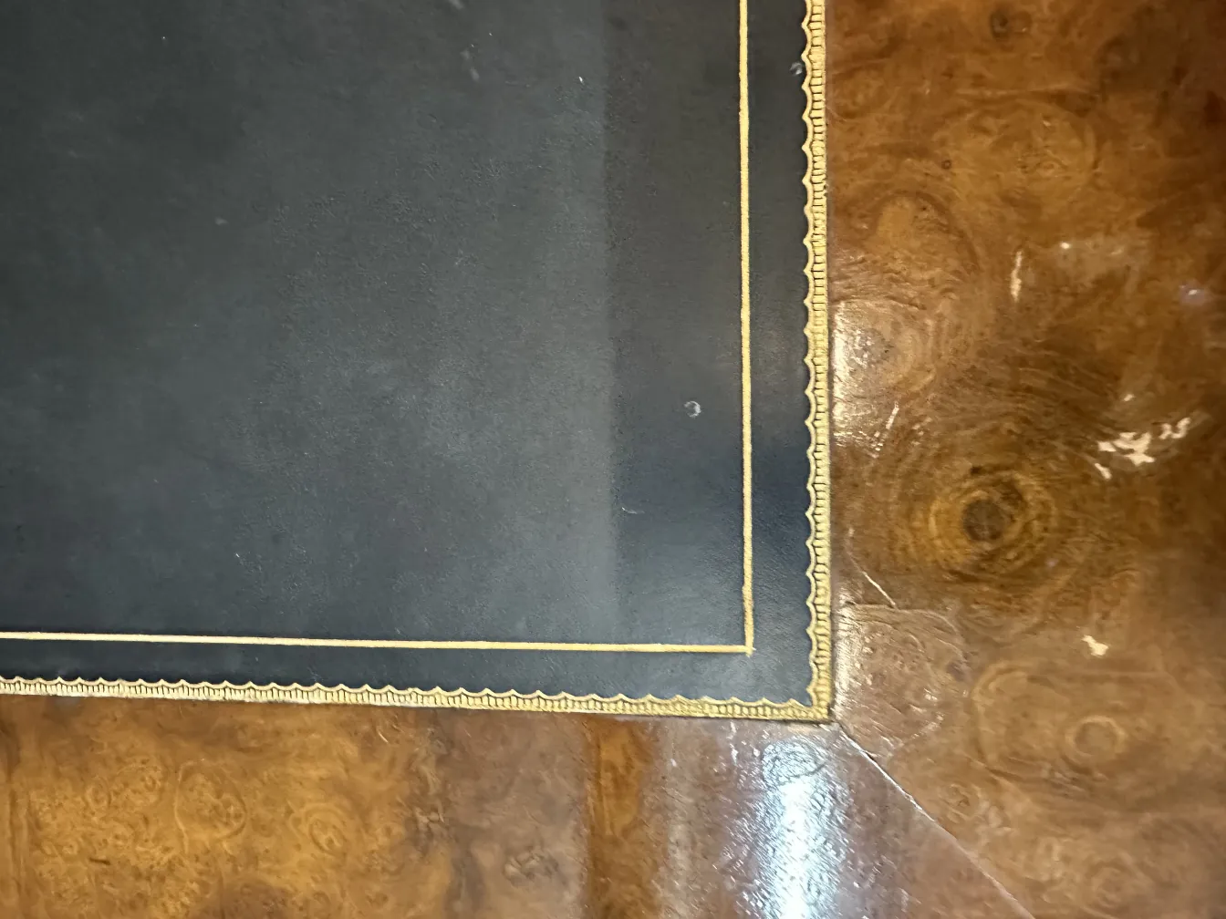 Top view of an antique decorative console with gold detailing