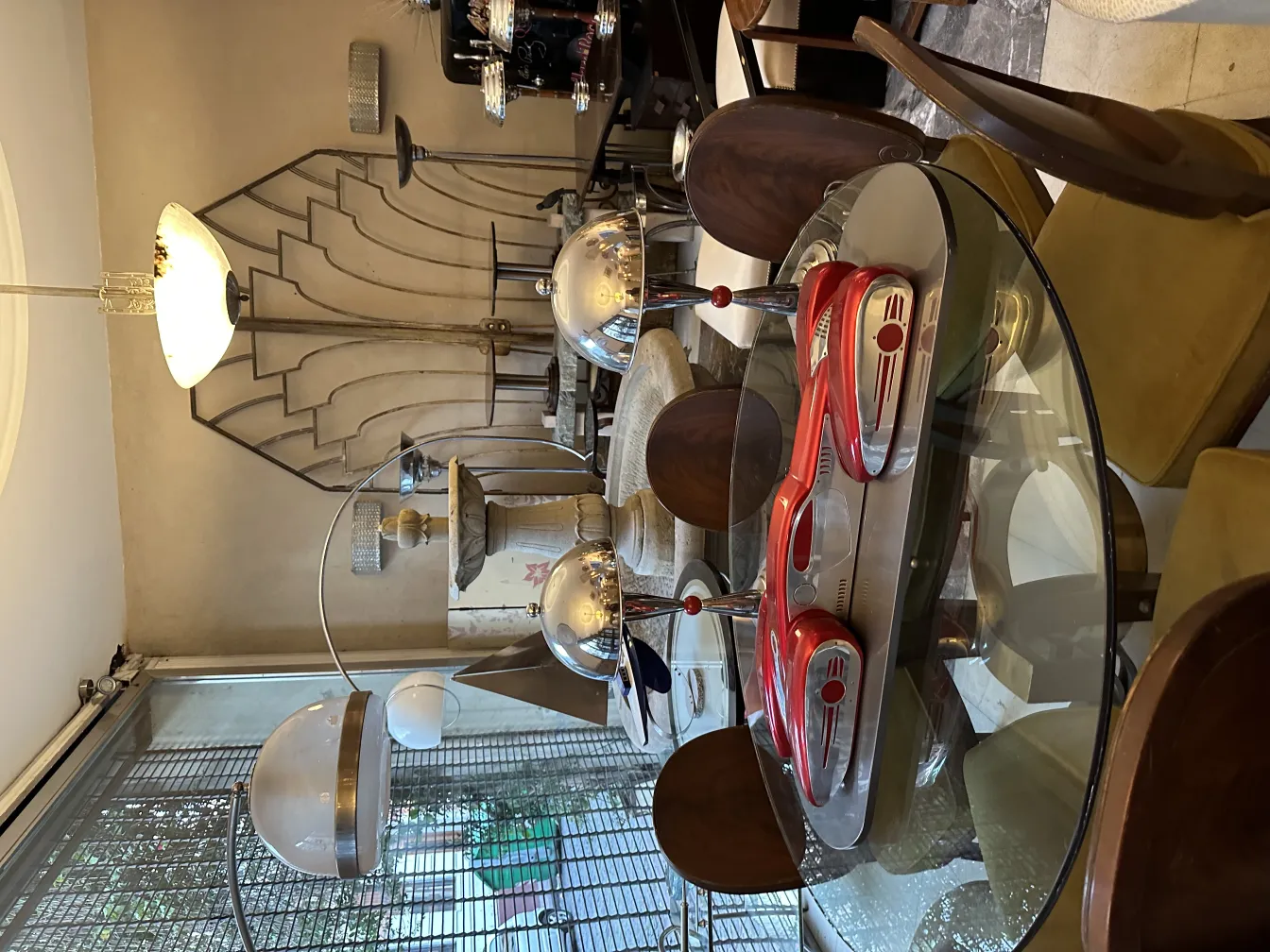 Antique designer car by Marcelo Peña showcased in a stylish modern setting with decorative elements.