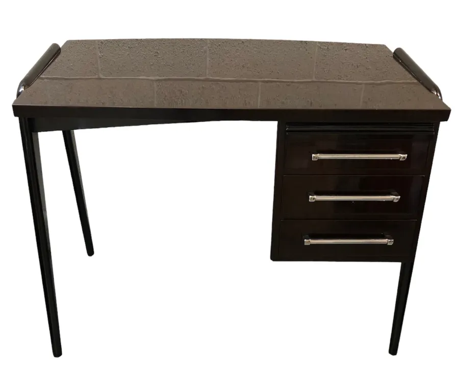 antique desk with a light surface and black legs, featuring three drawers